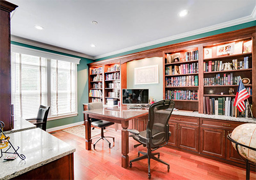 Home office with desk and bookshelves set up by our full home renovation company near Aldie, Virginia.