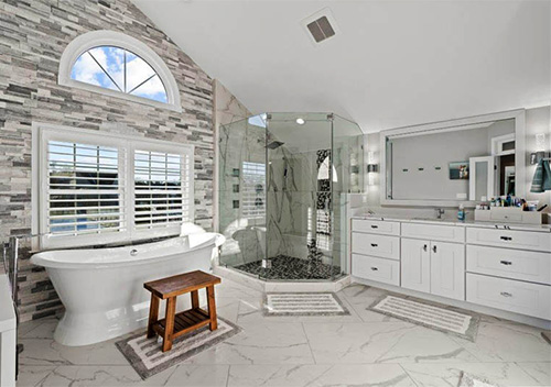 Bathroom with tub, shower, and sink unit installed by our Burke full house remodeling company.