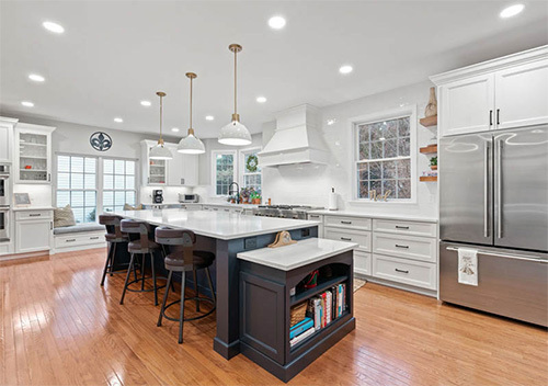 Kitchen renovation with fridge, cabinets, and island installed by our top remodeler near Arcola, Virginia.