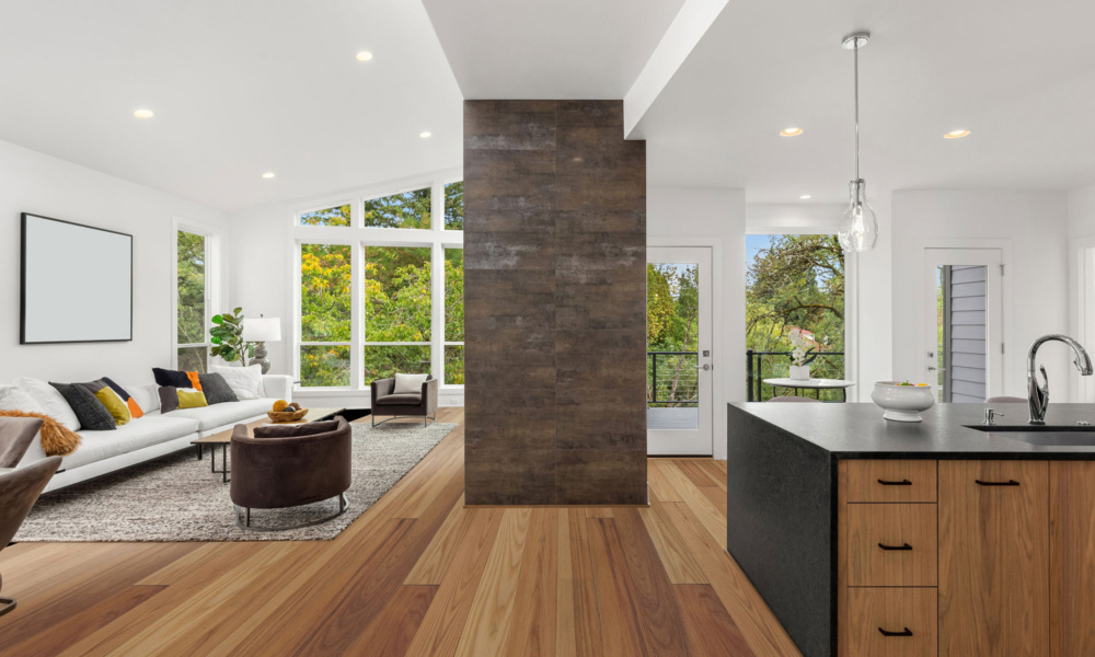 Living room and kitchen area with Haymarket hardwood floors.