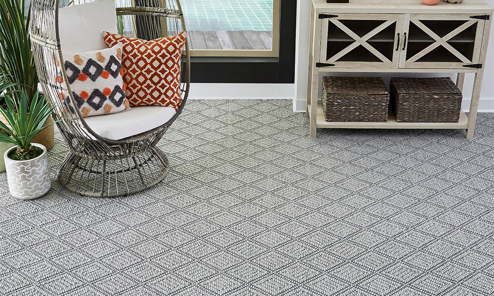 Furniture sitting on diamond-pattern carpet flooring near Dunn Loring, Virginia.