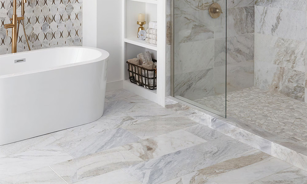 Bathroom with shower and tub on Alexandria stone tile floors.