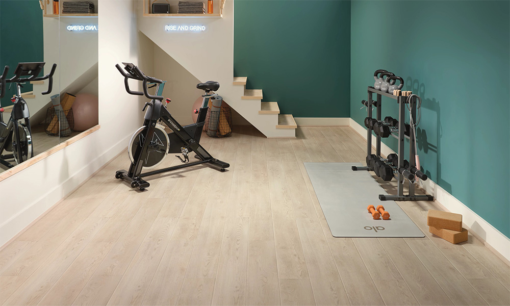 A basement exercise room with Countryside, Sterling vinyl floors.