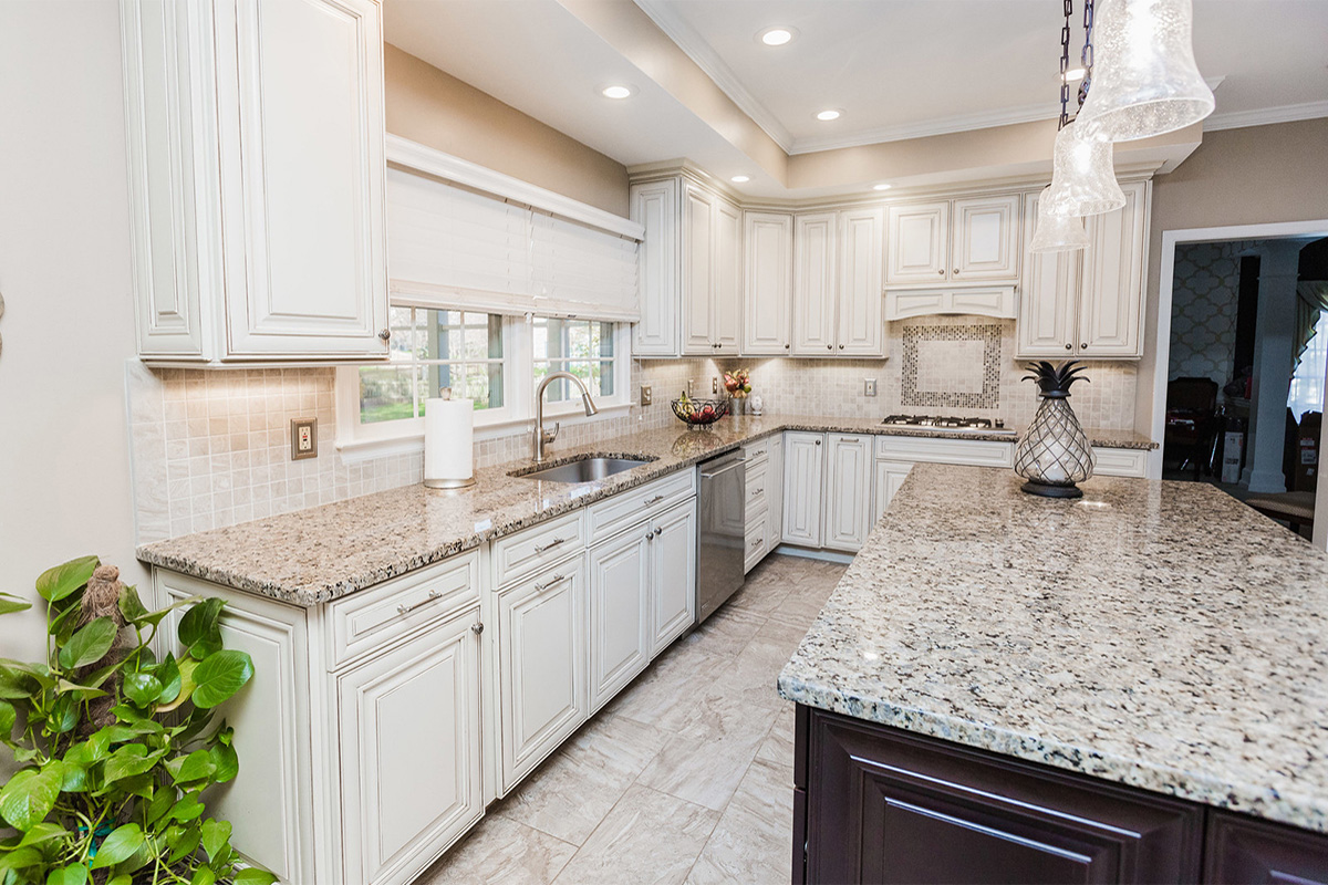 A beautiful kitchen with stone countertops done with our design and build services near Burke, VA.